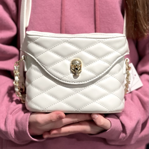 Betsey Johnson Handbags - Betsey Johnson white quilted crossbody bag with skull magnetic enclosure. Iconic